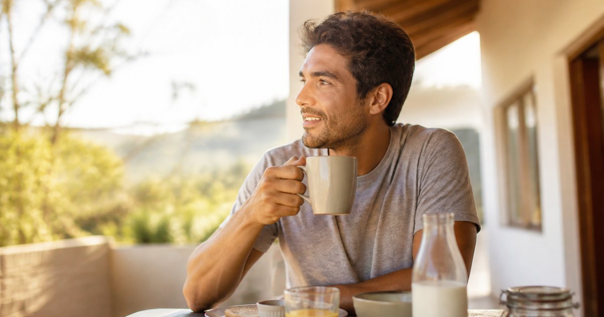 Person getting morning sunlight outdoors to help regulate their sleep-wake cycle
